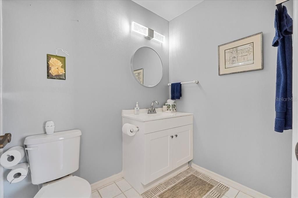 Second full bath has updated cabinetry and modern fixtures.