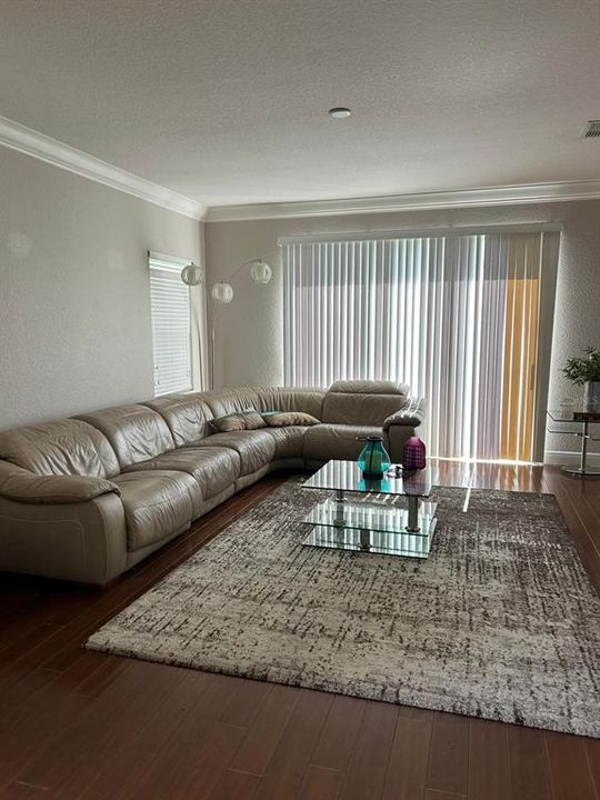 Living room features engineered wood flooring