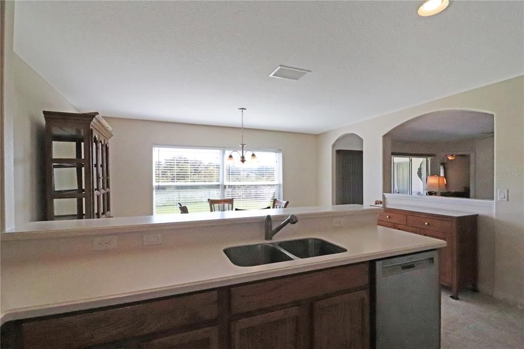 stainless appliances, recessed lighting and a breakfast bar