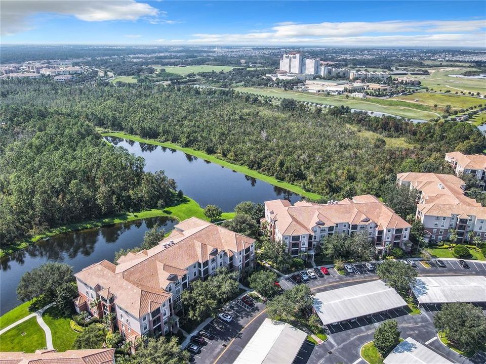 Aerial view seeing the 8298 building with the Omni Hotel and ChampionsGate Golf Course in the background.