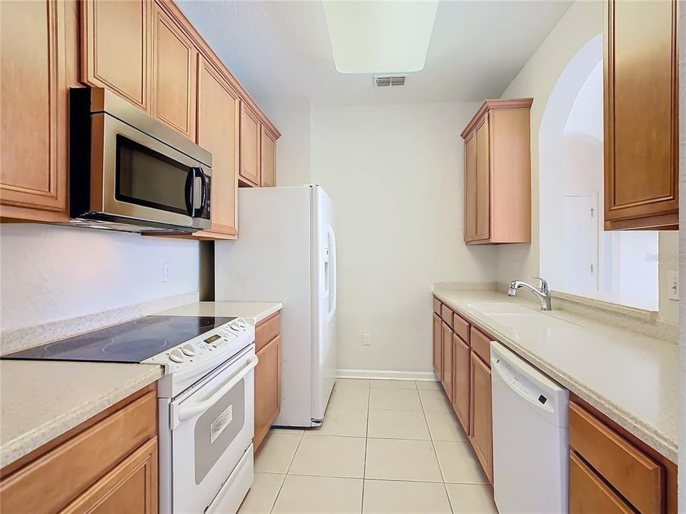 The kitchen provides a pass through allowing for light coming in from the living/dining room.