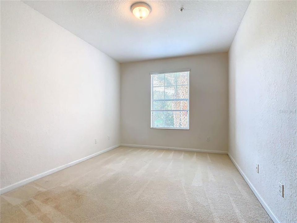 The walk-in closet in the guest bedroom.