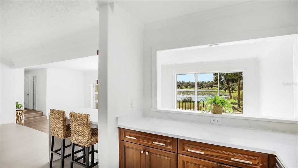 Tons of cabinetry with incredible quartz countertop with beautiful views of Lake Gracie!