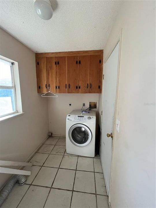 laundry room with washer