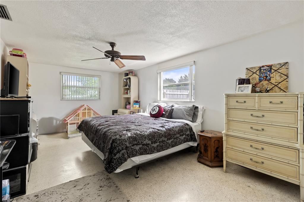 Owners suite featuring a walk-in closet, and ensuite bathroom.