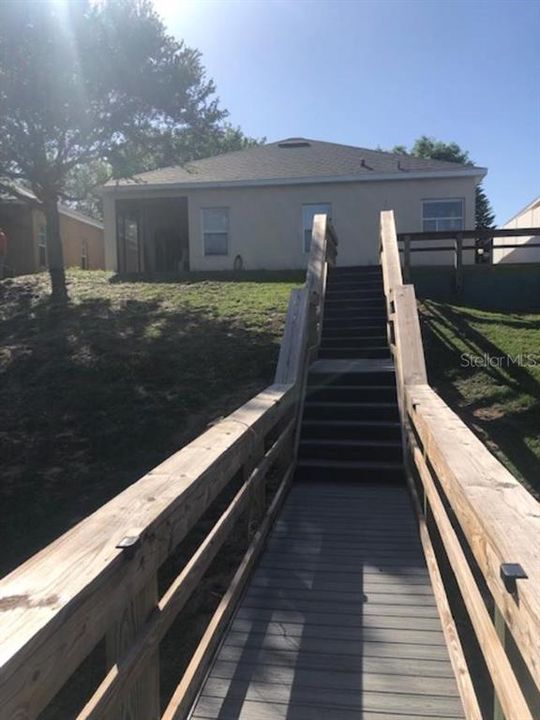 Back deck leading from lake to house.