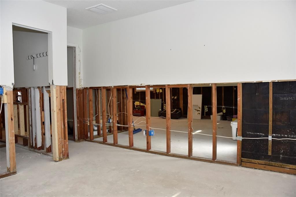 Primary bedroom with walk-in closet (left) and door to the hall. Current condition after mitigation of floodwater was done within 48 hours of the storm. 10/16