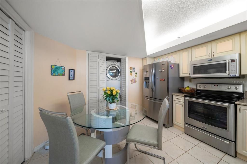 Stackable washer and dryer in kitchen