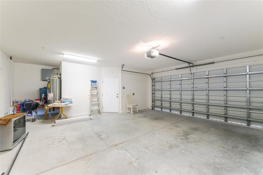 Garage entry to the inside landing and access to the elevator and stairs to second floor.