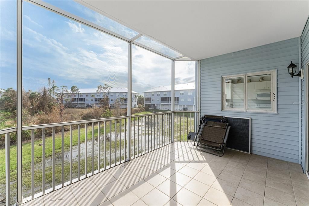 Extended screened lanai would be a great place for either morning coffee to evening cocktail!