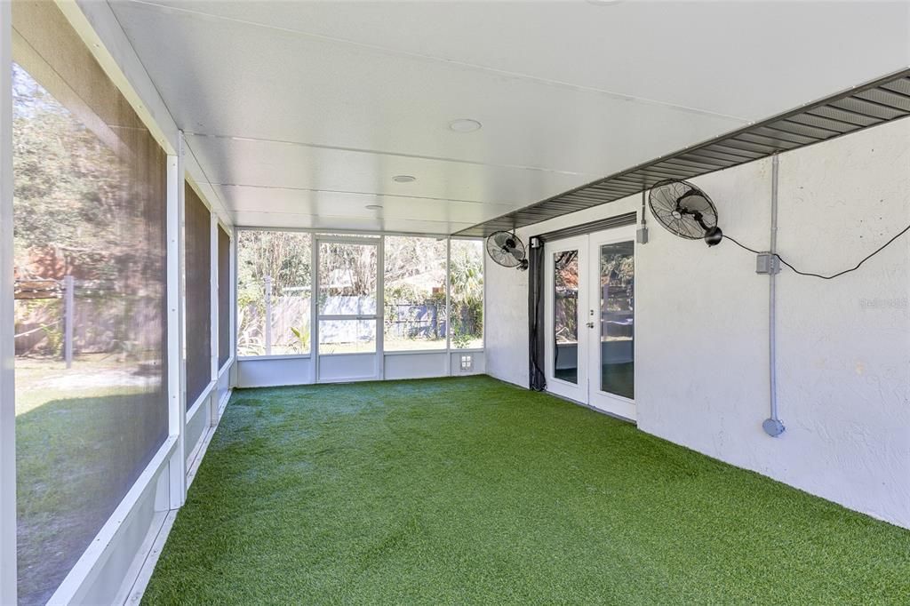 Screened patio with artificial grass