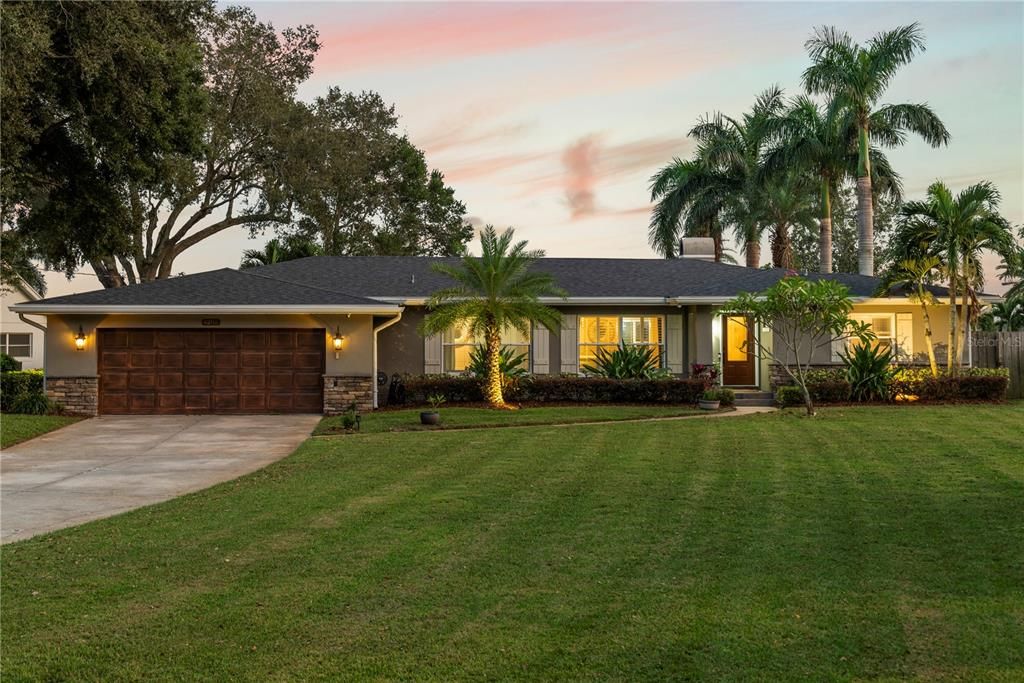 Spacious front yard, 2 car garage and long driveway