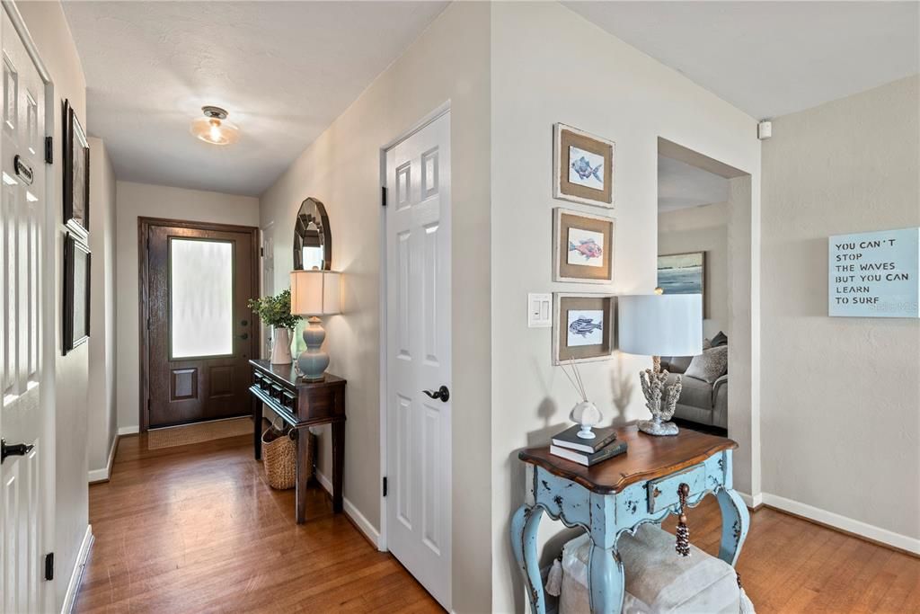 Entry- Lots of natural light and beautiful hardwood floors throughout