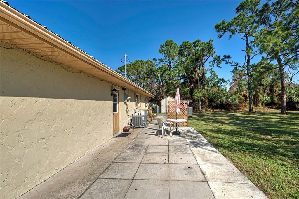 Extended Patio outside side-entry garage door