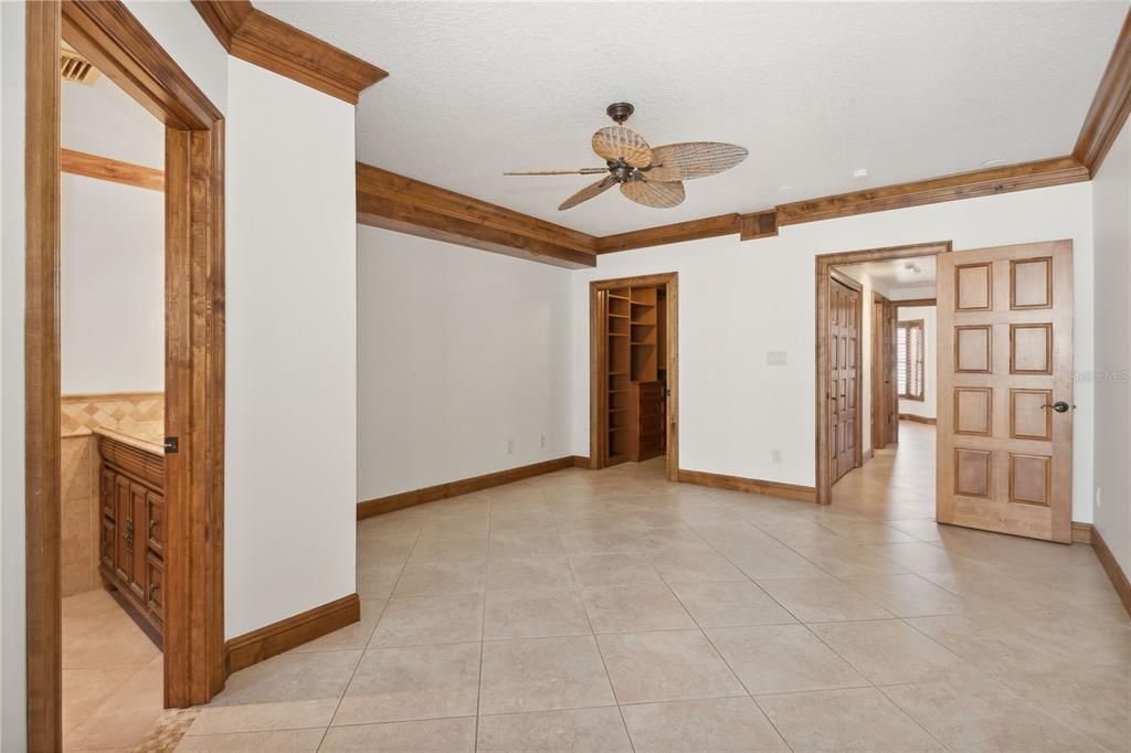 Primary bedroom with en suite bathroom and walk in closet