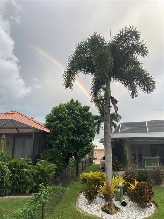 Rainbow over the exterior of the home