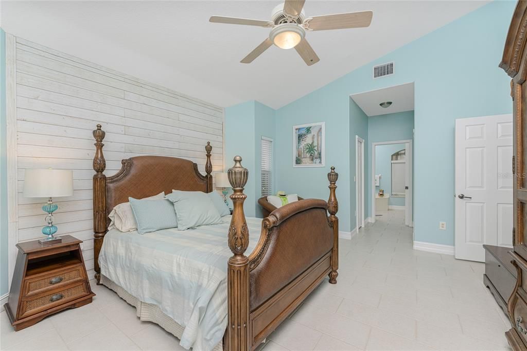 Porcelain Subway Style Flooring grace this Master en suite showcasing shiplap accent wall.