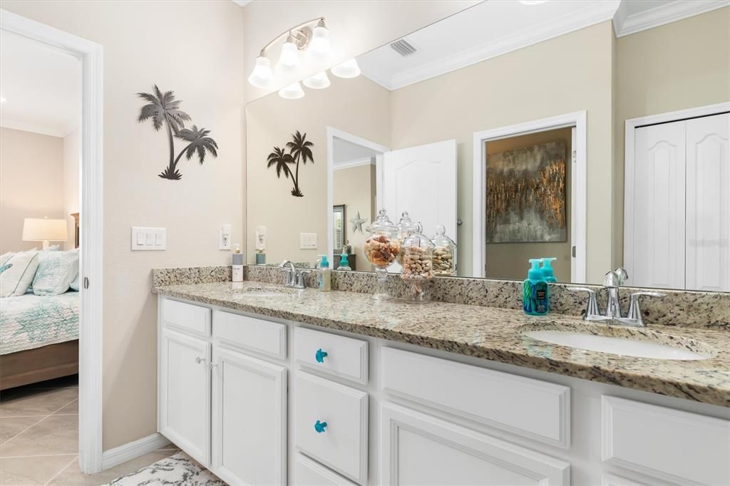 Double sinks and granite countertop.