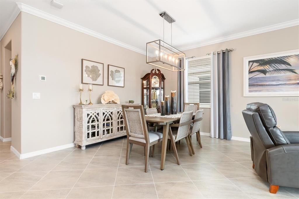 Designer light fixture in dining room.