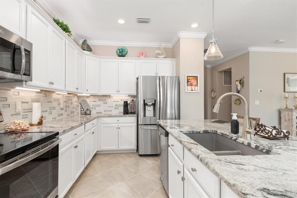 Stainless steel appliances and farmers sink.