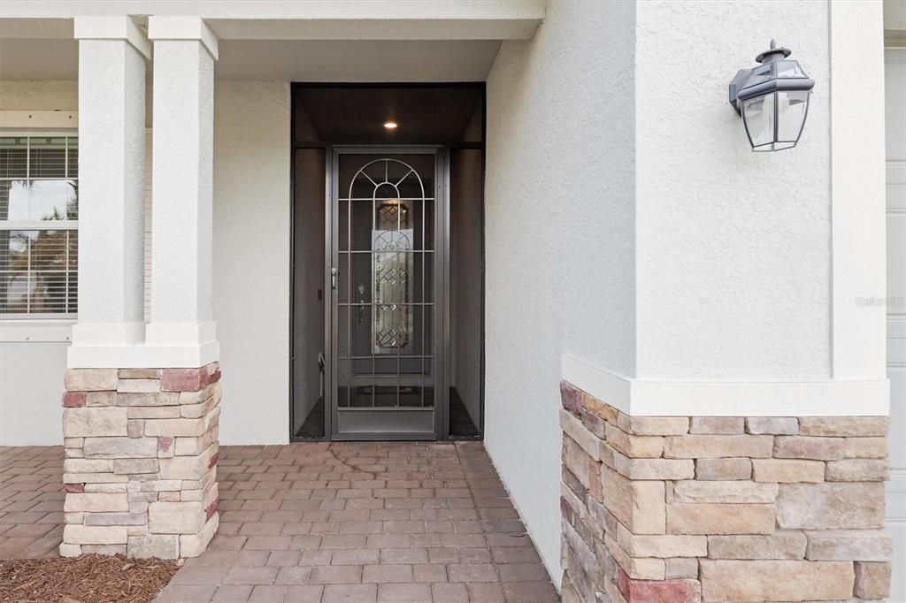 Stacked stone highlights front porch.