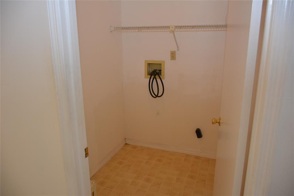 Utility room is off the foyer