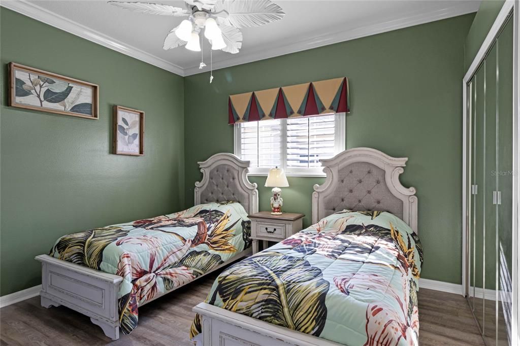 Bedroom #2 with Plantation Shutters, Ceiling Fan and Solid Surface Flooring