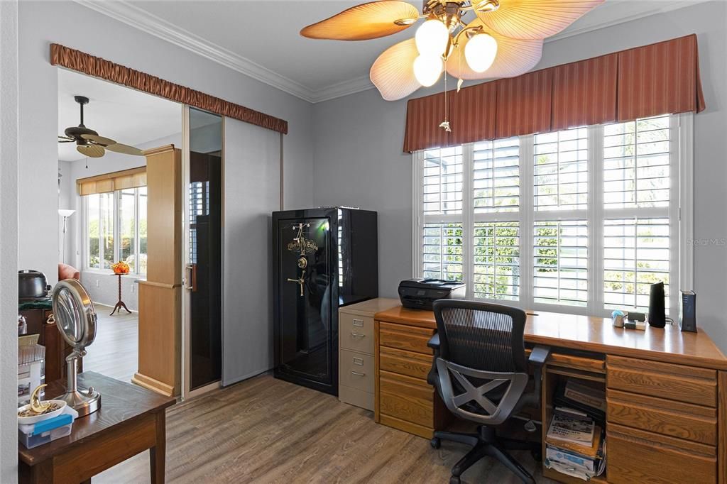 Sitting Room features Plantation Shutters and access into the Four Seasons Room