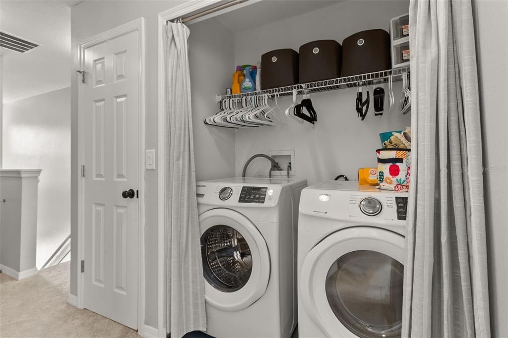 Laundry closet and large linen closet separate the 2 primary suites