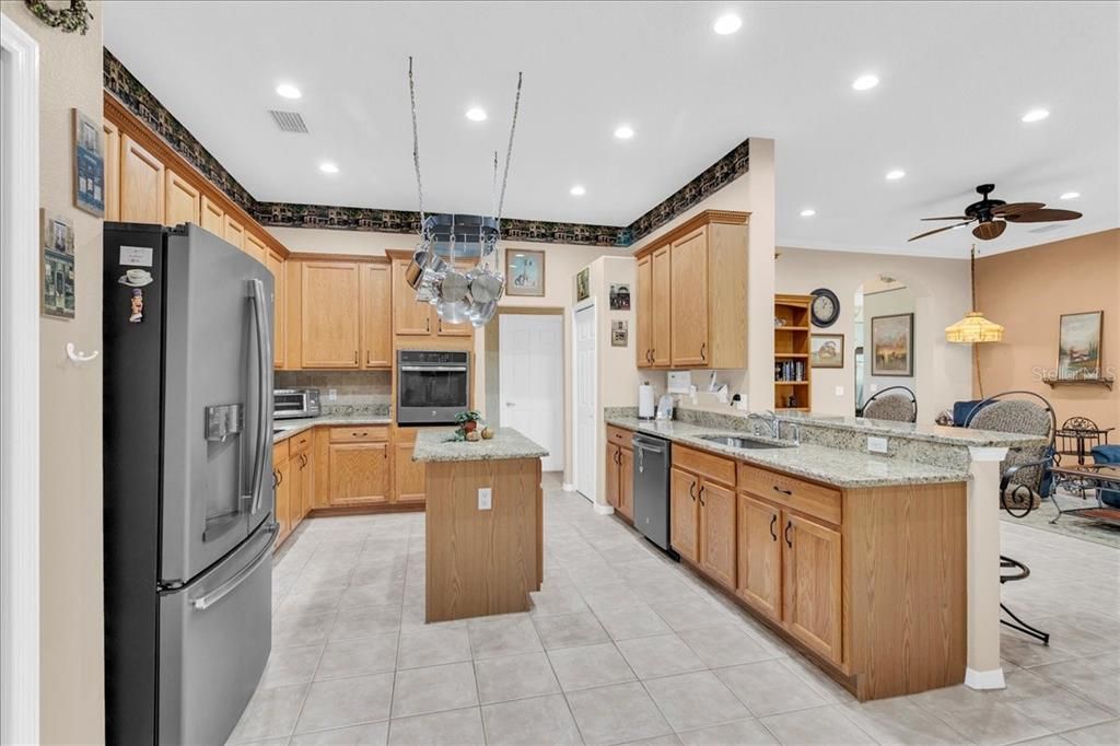 Large kitchen with island, pot rack, 2 pantries and granite counters!