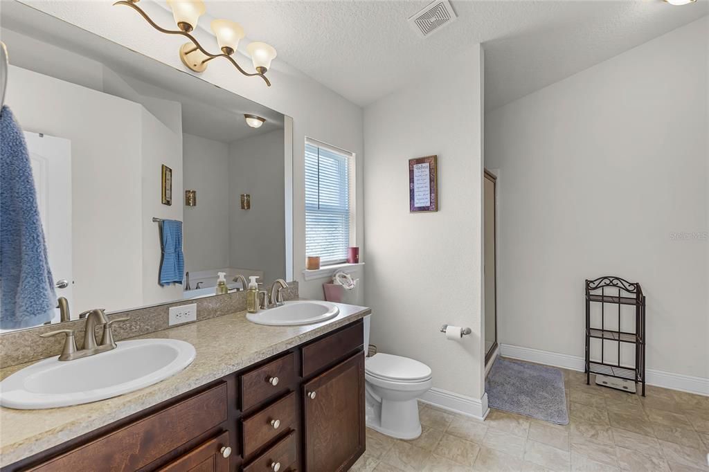 Dual Vanities and Standup Shower and Bathtub