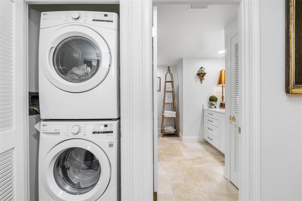 Discreet laundry closet off of main hall