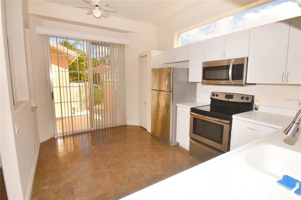 Kitchen with sliding door to front courtyard