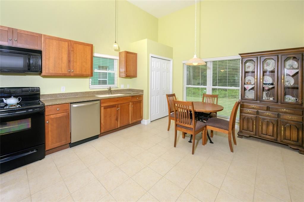 Large Farmhouse-sized Kitchen with views to the greenspace through the rear garden