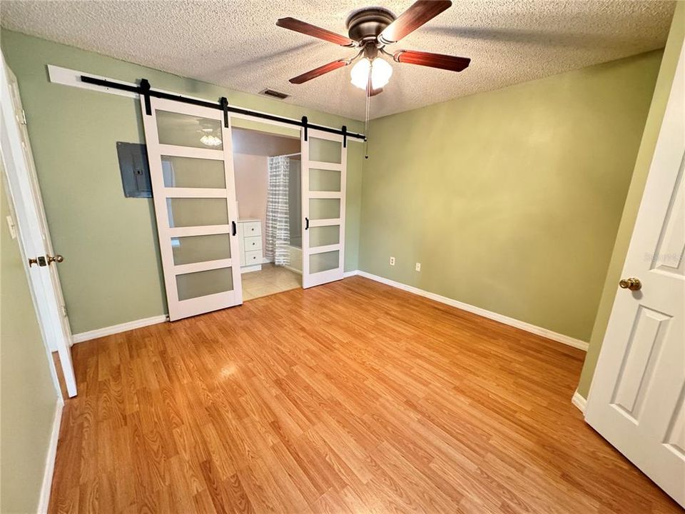 Master Bedroom with barn doors and walk in closet