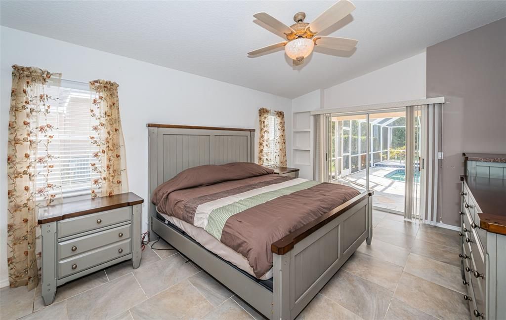 Primary Bedroom - Sliders to the pool - Tile Floors