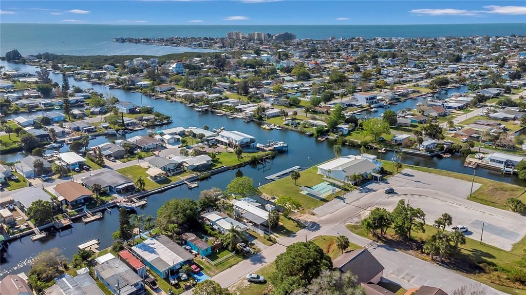 This photo was taken from the clubhouse located on Tiller Drive.  Beacon Court is 3 streets up and home can be seen in this photo as the last home on right side of Beacon with its land extending in front of it.