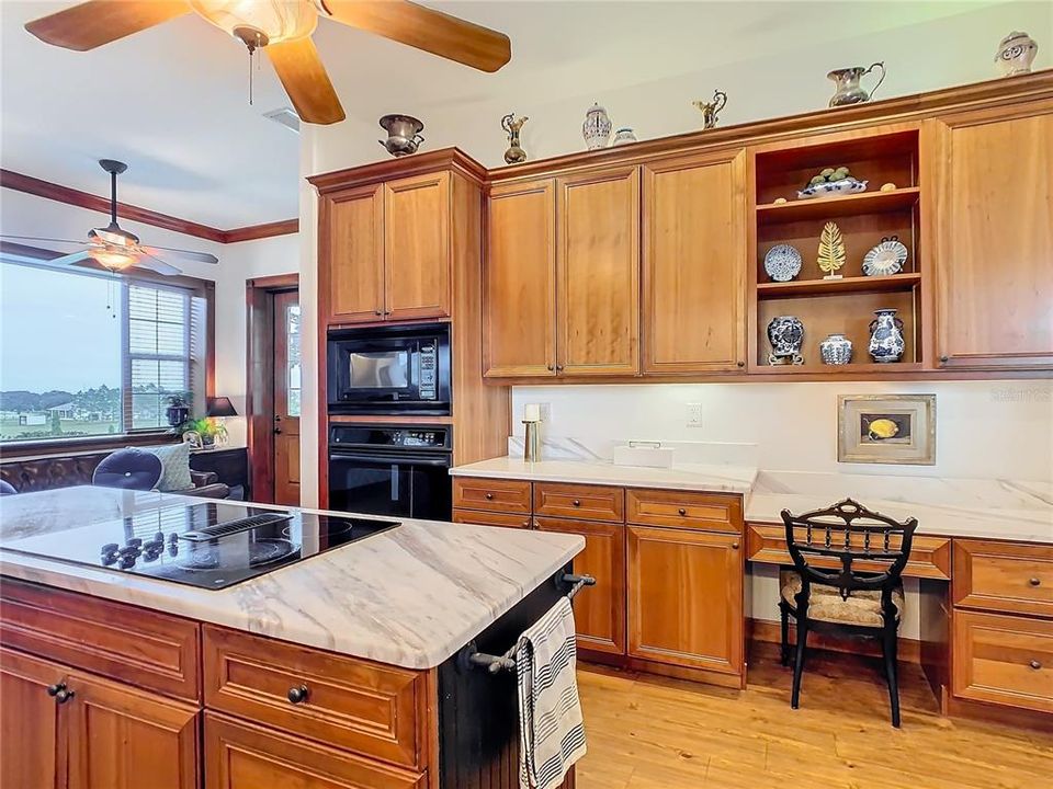 Beautiful marble counter top adds a striking balance to the wood cabinets.