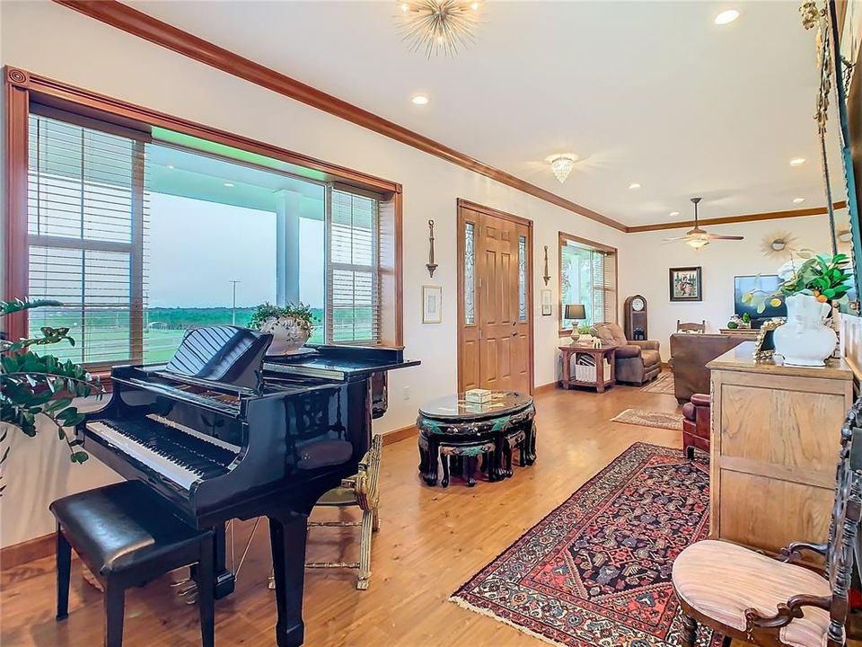 Large picture windows in the living room provide gorgeous views of the front porch and outdoors.