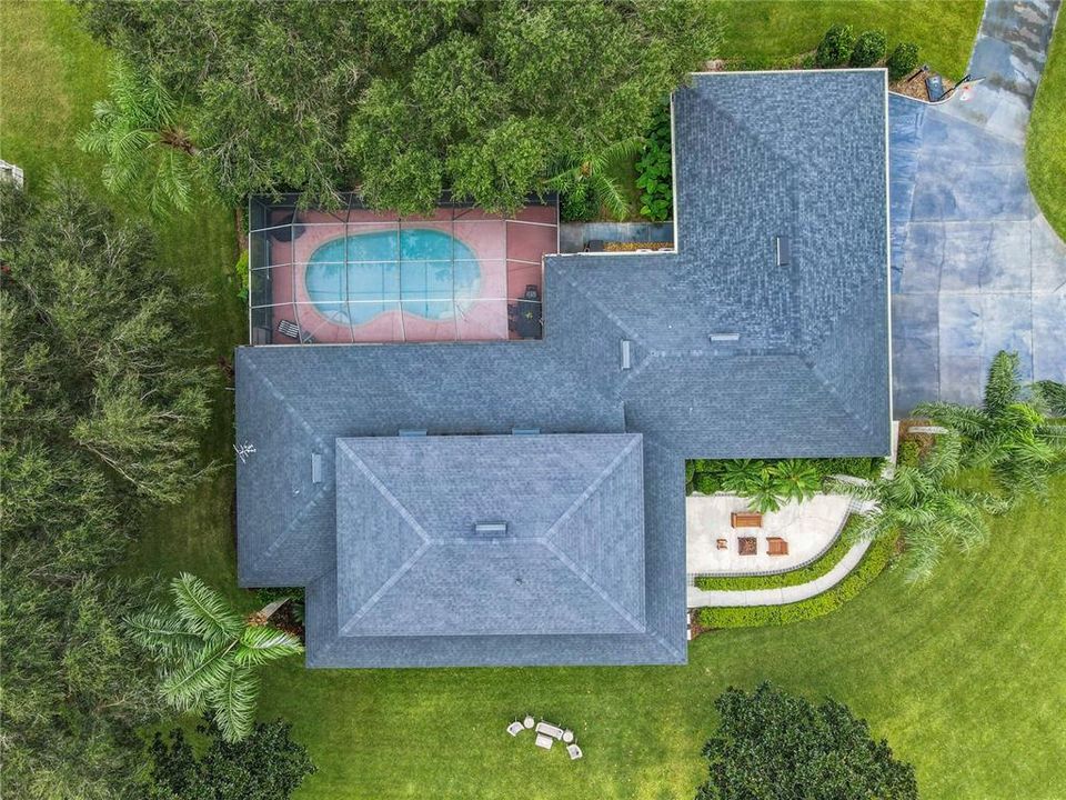 Top view of the home, screened pool/lanai, and front patio.