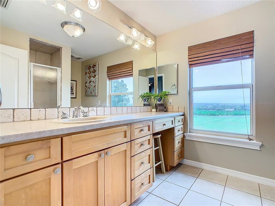 Upstairs bath has a large vanity and walk-in shower.