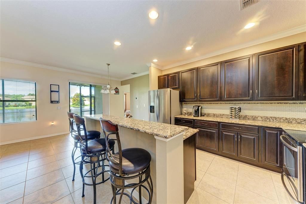 Kitchen with breakfast bar and dinette area