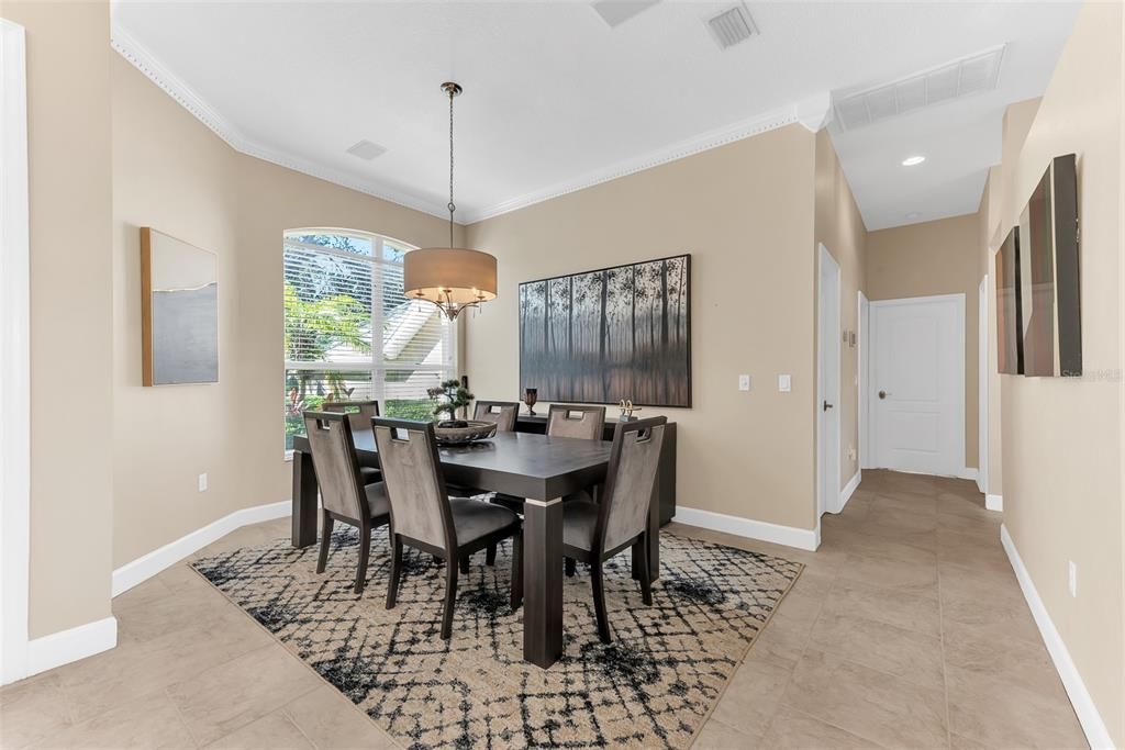 Formal Dining room with crown molding.