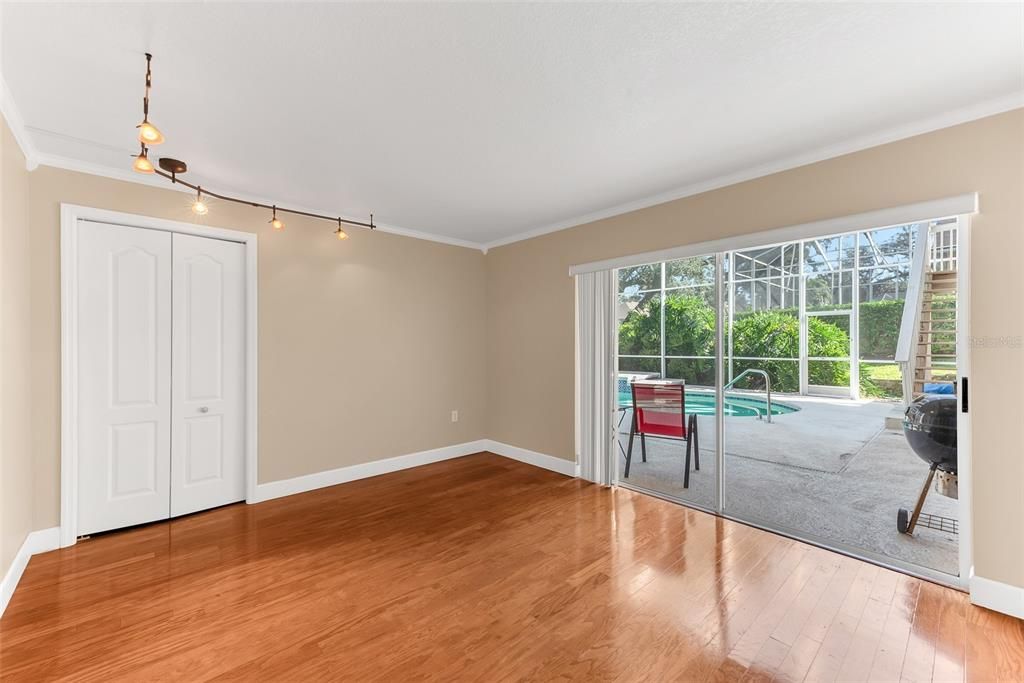 2nd room downstairs with walk-in closet, crown molding, wood floors and private entrance via  sliding door.