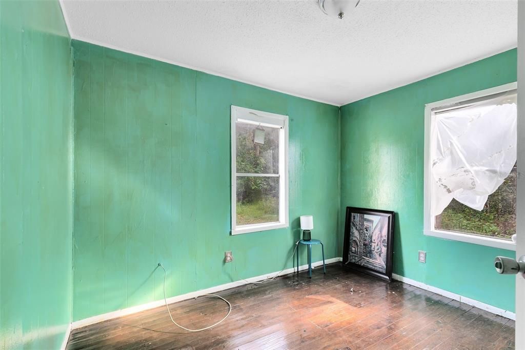 Refinished hardwood floors in bedrooms.