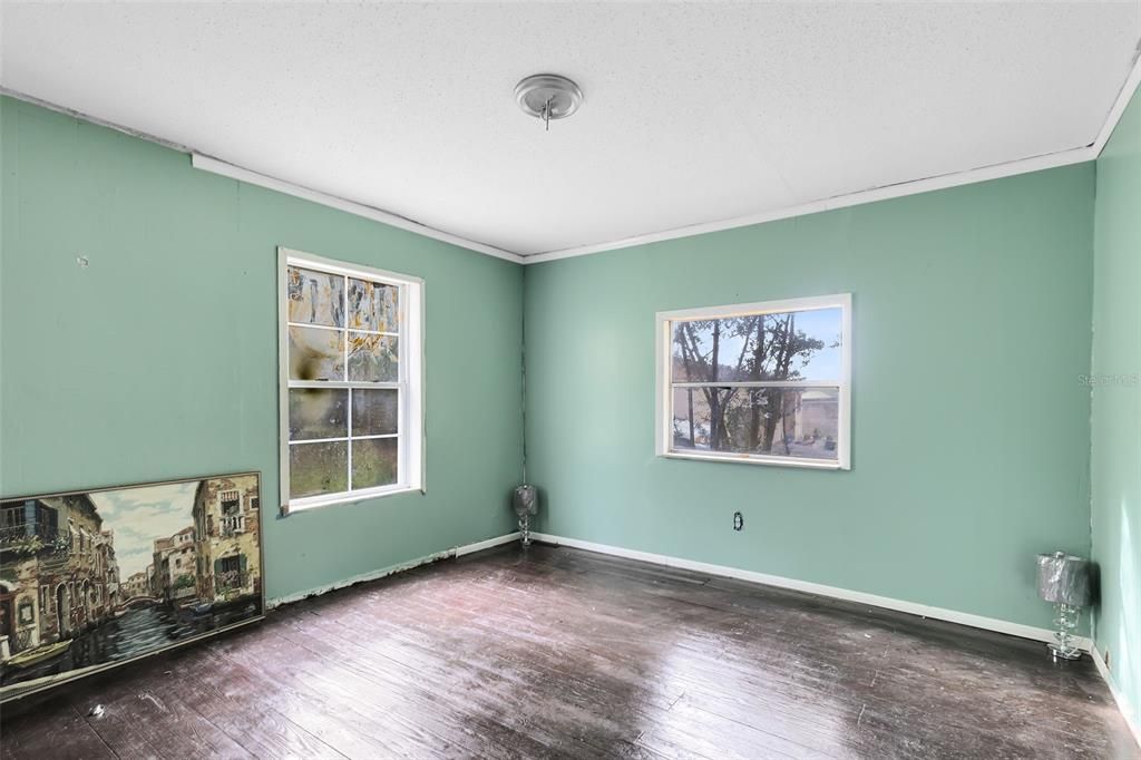 Refinished hardwood floors in bedrooms.