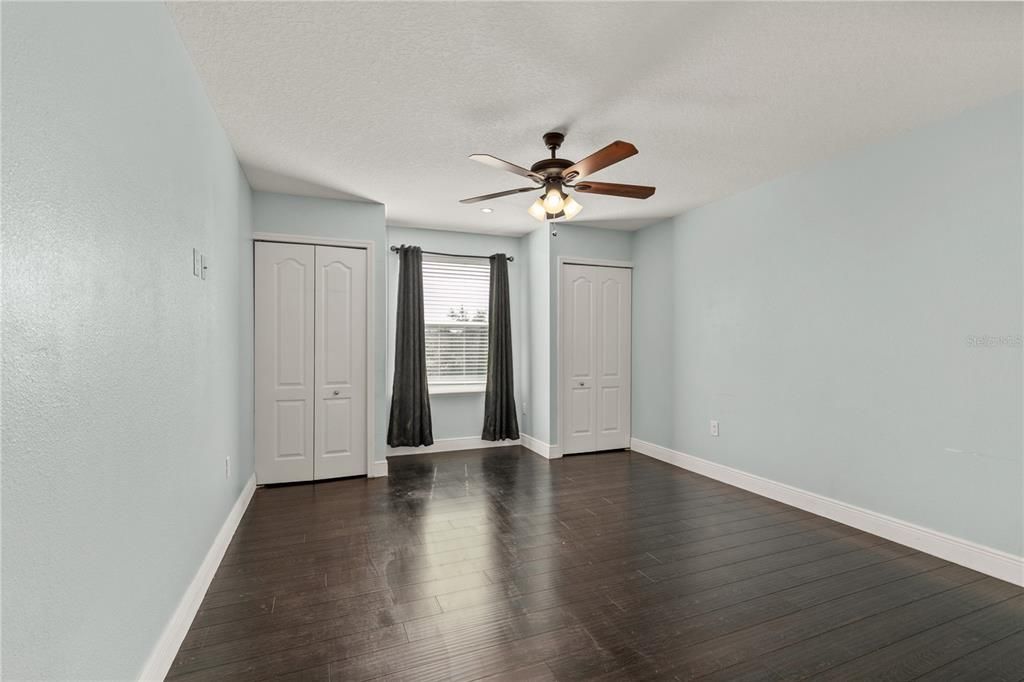 Second story Bedroom #2 is the same size as #1, same flooring and double closets , fan and blinds.