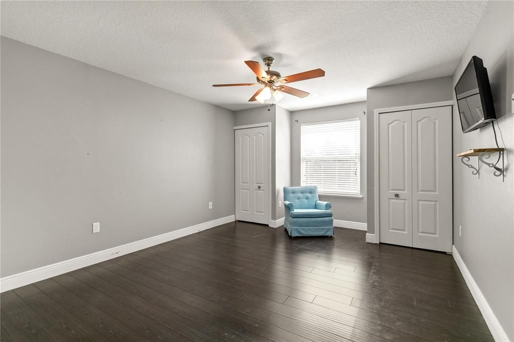 Second story Bedroom#1 has the laminate flooring, double closets, a reading nook, ceiling fan and blinds