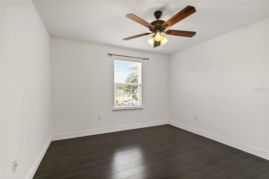 Second Story Bedroom #4 is the smallest of all the bedrooms and is in the front of the house next to the Primary Suite.