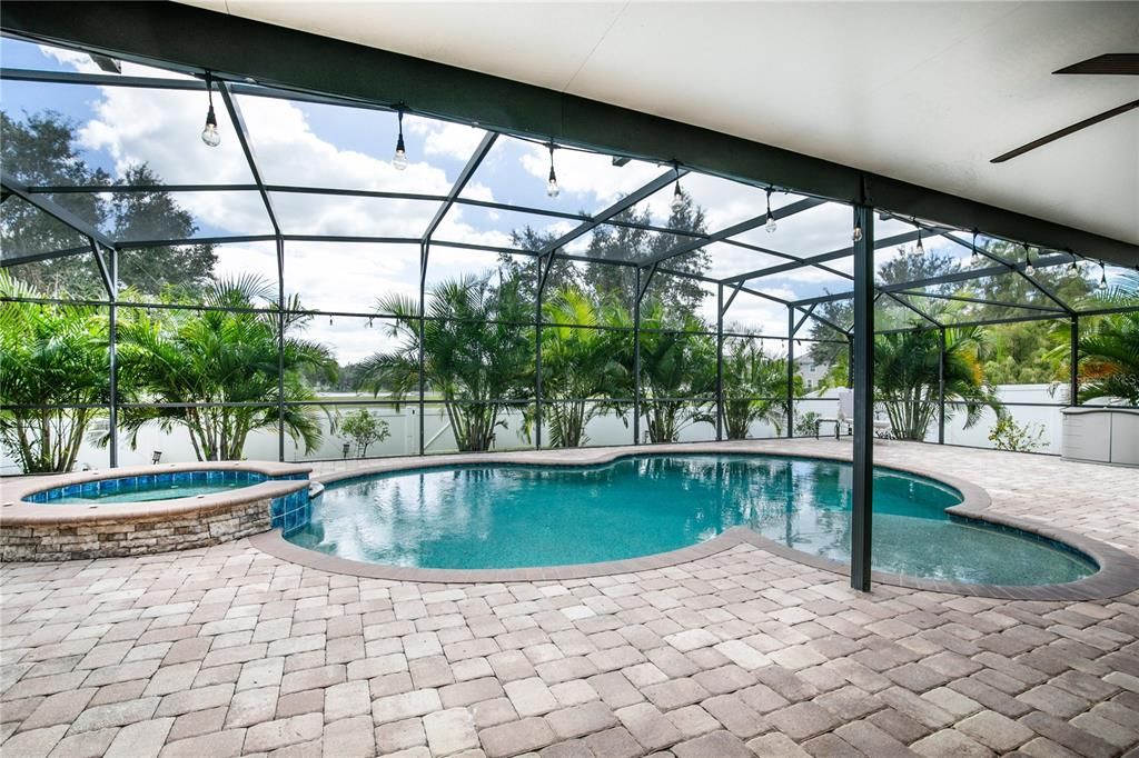 Step outside into paradise with the In-ground pool and spa surrounded by a screened 29'x54' Lanai